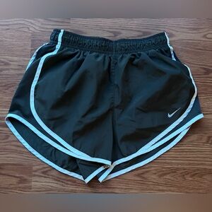 Nike running shorts. Dark gray with white trim. Excellent preowned condition.